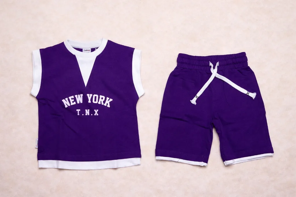 Purple kids' outfit with New York print.webp